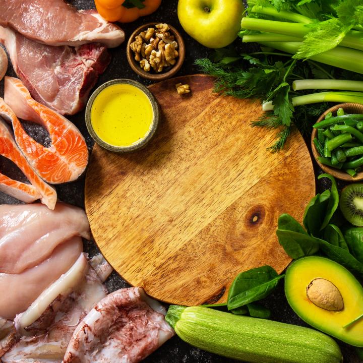 Array of raw meats and vegetables on a table