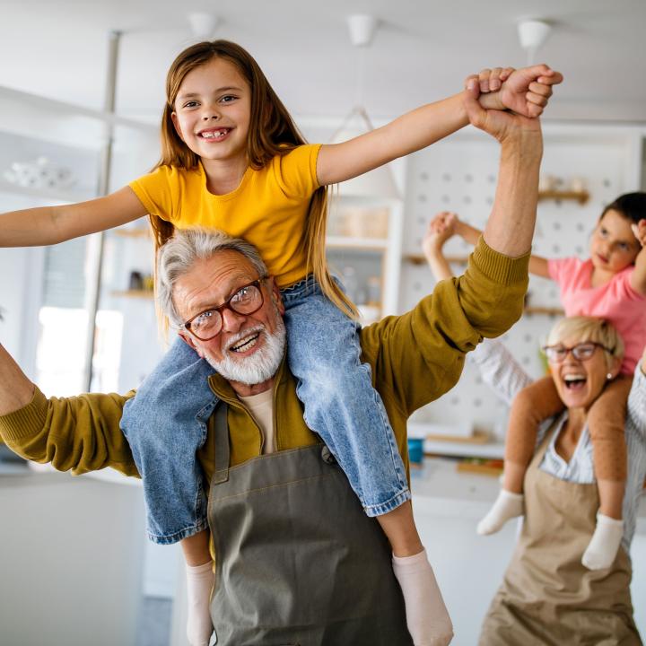 Grandparents playing with grandchildren