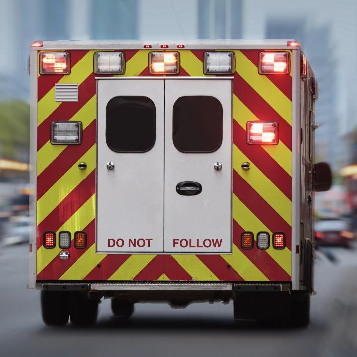 Back of ambulance driving down street