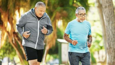 Two senior men getting a walking workout outside