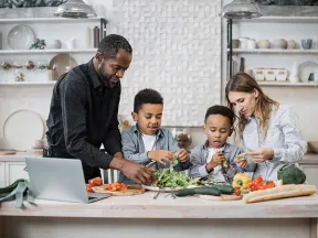 multinational mom and dad enjoying healthy cooking