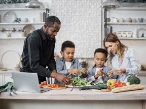 multinational mom and dad enjoying healthy cooking