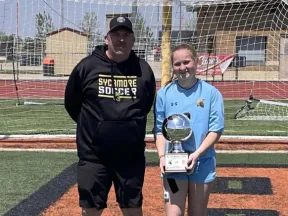 Photo of Brooke holding a trophy