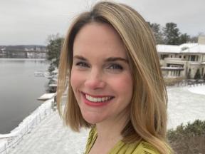 Portrait of a woman outside in snowy weather.