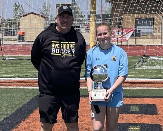 Photo of Brooke holding a trophy
