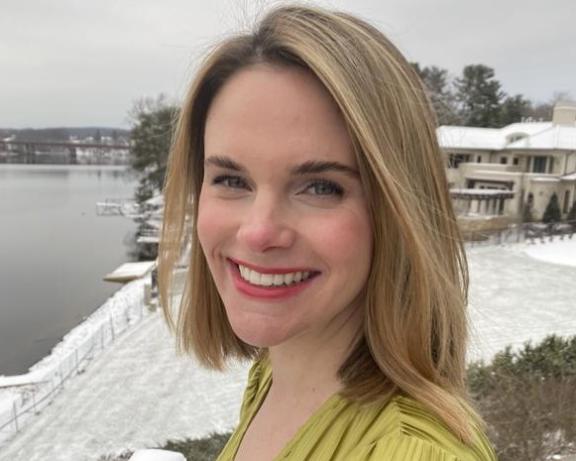 Portrait of a woman outside in snowy weather.
