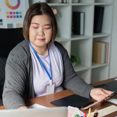 Asian woman working at desk