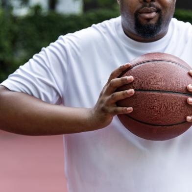 A man holding a basketball