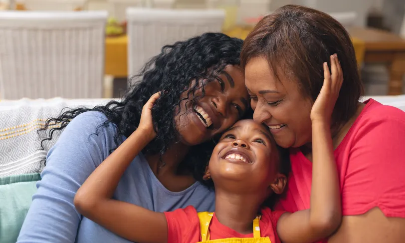 Happy family of a girl, mother, and grandmother
