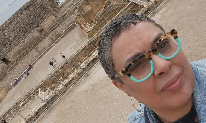 Photo of Maria in front of historic site