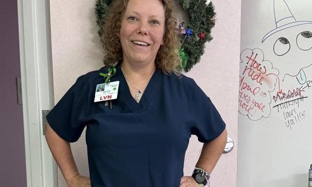 Photo of Marlena standing in a Nurse's uniform