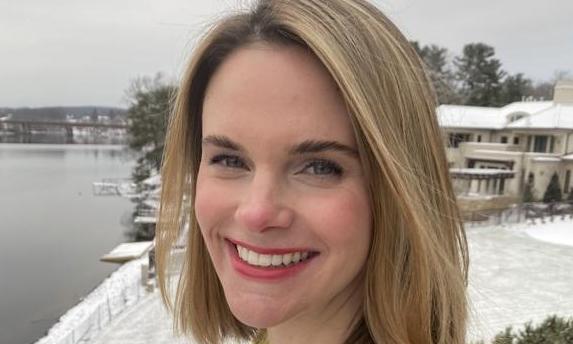 Portrait of a woman outside in snowy weather.