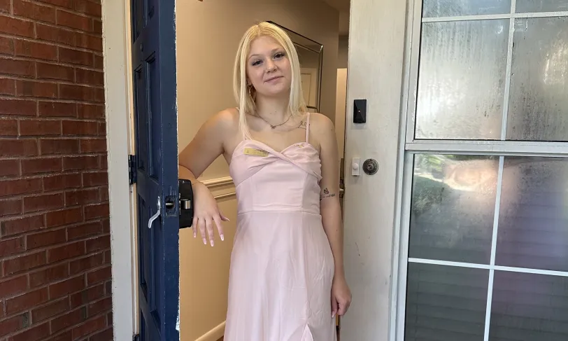 Photo of woman standing in a doorway