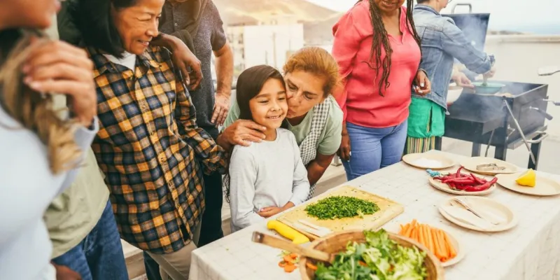 Family cooking food outside