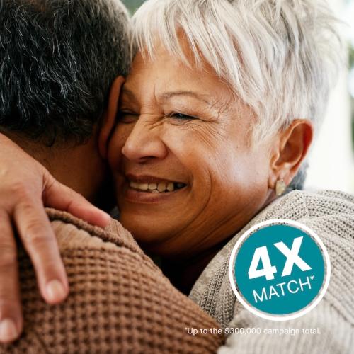 An elderly woman hugging a man. 4X Match* in green circle. *Up to $300,000 campaign total