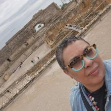 Photo of Maria in front of historic site