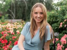 Photo of Kathryn sitting with CGM showing on arm