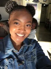 Woman taking a selfie and smiling at the camera