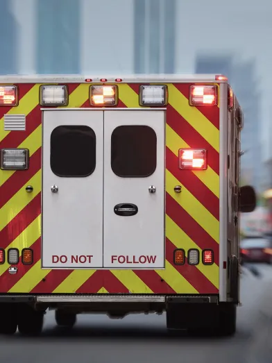 Back of ambulance driving down street