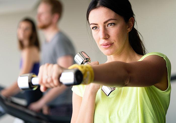 Woman exercising with dumbbells